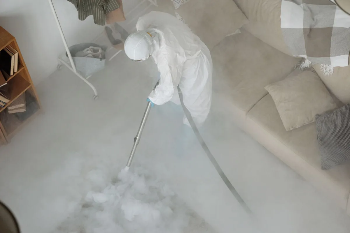Biohazard cleanup technician in protective equipment, Montegut, LA